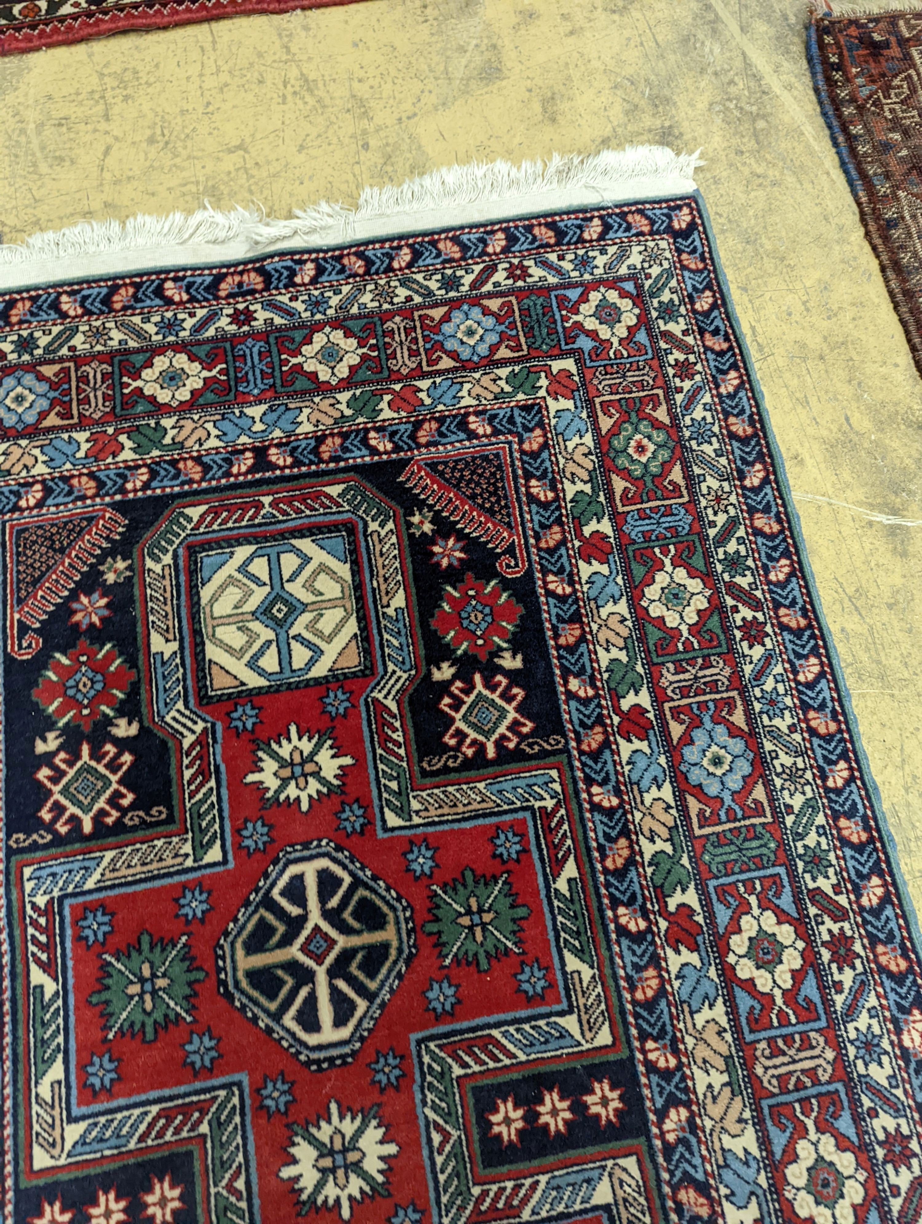 A Caucasian blue ground rug, 166 x 100cm